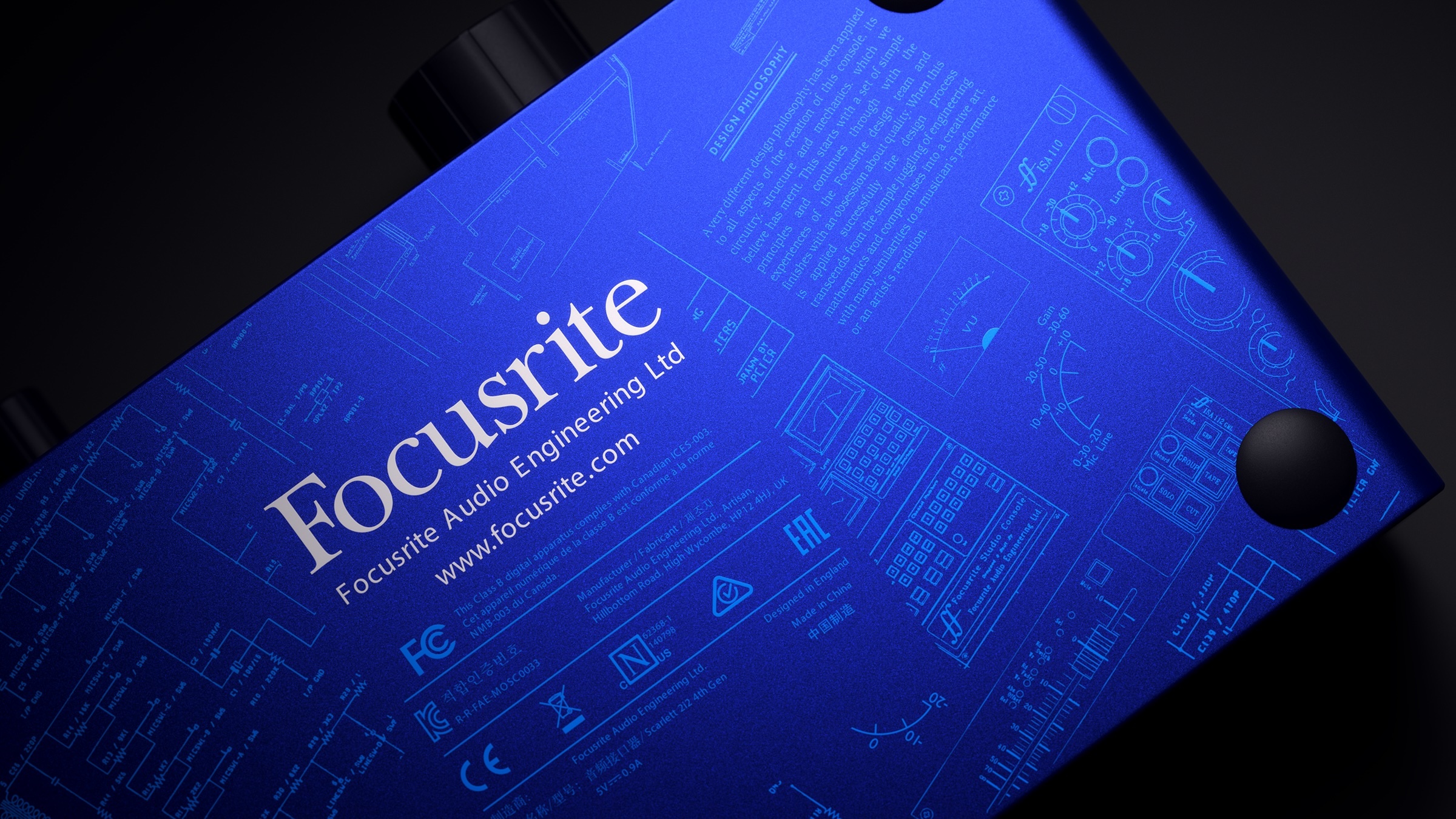 Image of Scarlett 2i2 Anniversary Edition audio interface. This image shows the underside of the unit which has a silkscreen of the ISA circuit diagrams.
