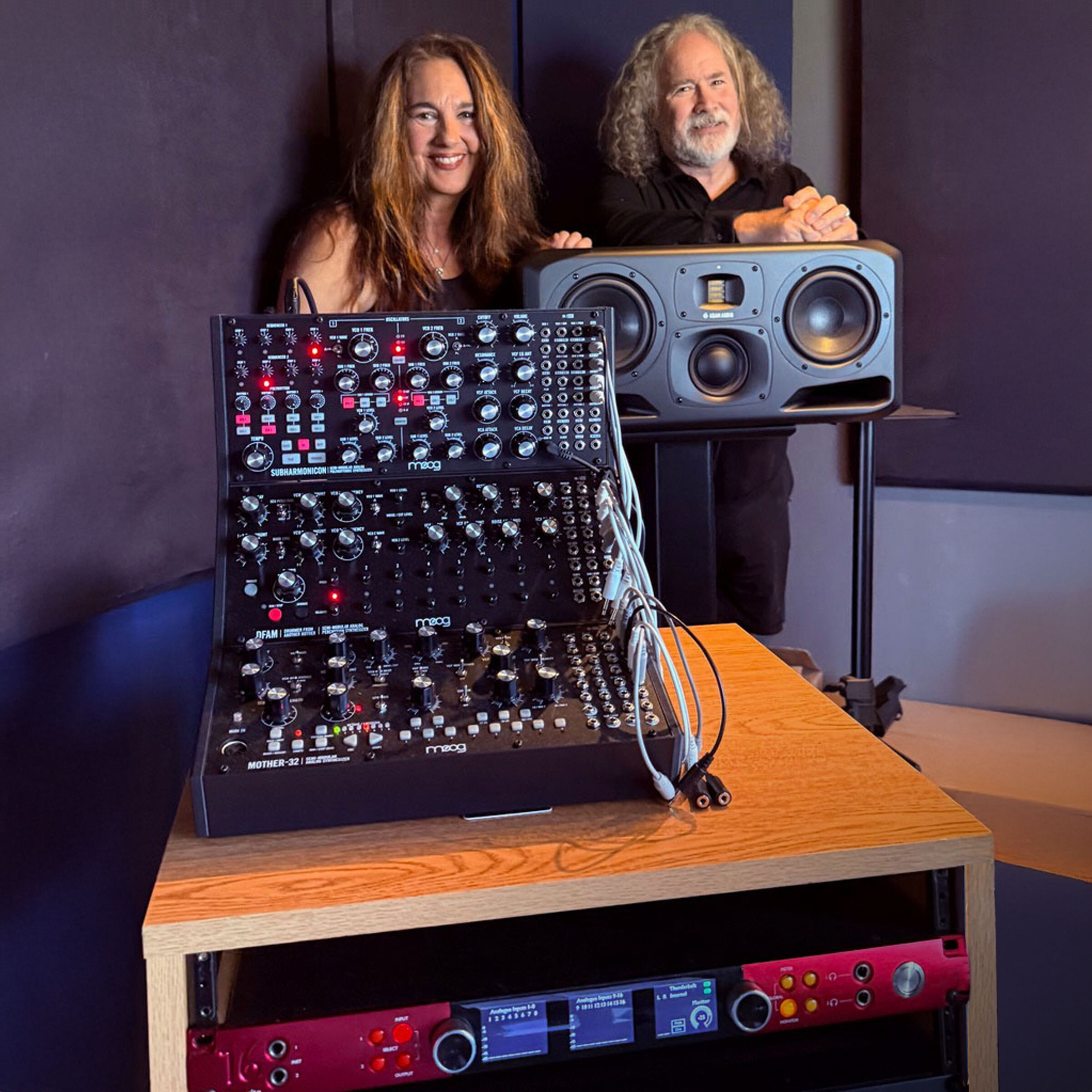 Starr Parodi and Jeff Fair, pictured with some of their newly acquired gear (including monitors from ADAM Audio and Focusrite interfaces), serving as a replacement setup for their gear lost in the wildfires earlier this year.
